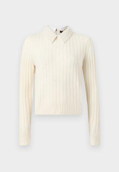 Pull crème côtelé à manches longues avec col pointu texturé orné de perles et ourlet droit.