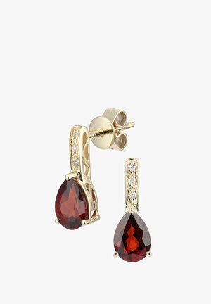 Øreringe i guldtone med en pæreformet rød ædelsten og glitrende detaljer. Tekstureret design, lille stiftlukning for sikker pasform.