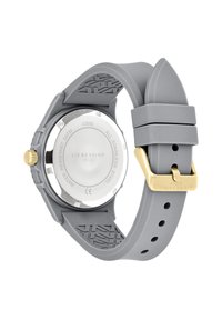 Grau Silikonarmbanduhr mit einem Edelstahlgehäuse, goldener Krone und Schnalle. Verfügt über ein strukturiertes Armband und eine gravierte Rückseite. Wasserdicht bis 5 ATM.