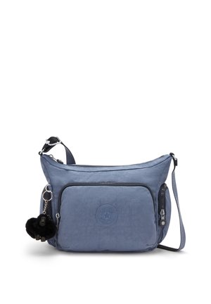 Borsa a tracolla blu in nylon con finitura texturizzata, dotata di tasca anteriore con zip, tracolla regolabile e ciondolo a pom-pom nero attaccato.