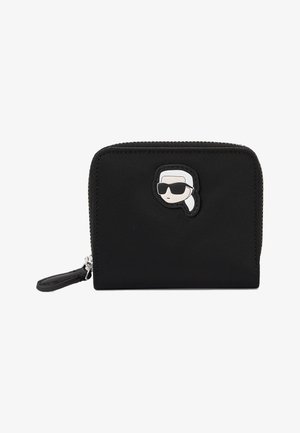Fekete nylon tárca cipzárral, az elején napszemüveget viselő rajzfilmszerű arccal. Kompakt kialakítás, texturált felülettel.