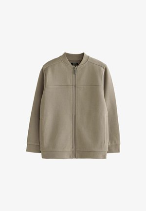 Khakifarbenes Zip-Jackett aus strukturiertem Stoff, mit Rundhalsausschnitt, zwei Seitentaschen und gerippten Bündchen. Einfaches, minimalistisches Design.