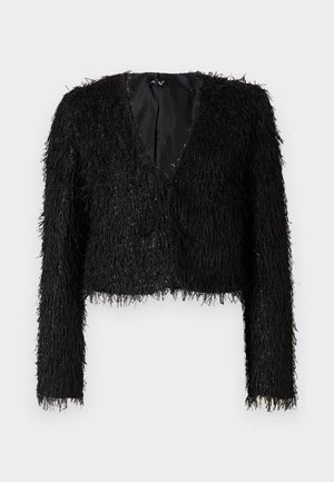 Black cropped jacket made of textured fur-like material with a deep V-neck, long sleeves, and detailing that adds visual interest.