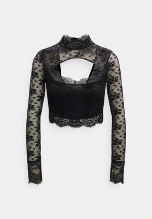 Černý krajkový krátký top s dlouhými rukávy, zdobený květinovými vzory, vysokým límcem a výstřihem na zádech do písmene U. Na manžetách texturovaná krajka.
