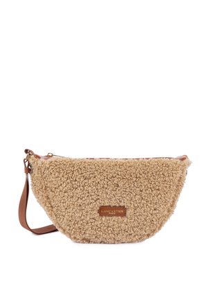 Beige faux fur crossbody bag with a rounded shape, brown leather strap, and a gold zipper. Features a branded leather patch on the front.