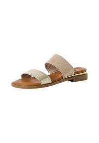 Sandal s remenom od brušene kože u bež boji, metalik zlatnim remenom i niskom petom. Uložak za nogu je smeđe boje sa glatkom teksturom.