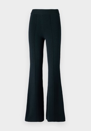 Flared black pants with a ribbed waistband, textured fabric, and vertical seam detailing. Features a fitted top and flared bottom design.