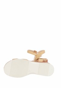 Sandalbeige con design a strap incrociati e fibbie. Suola in gomma con texture rigata per una migliore aderenza. Parte posteriore aperta e costruzione leggera.