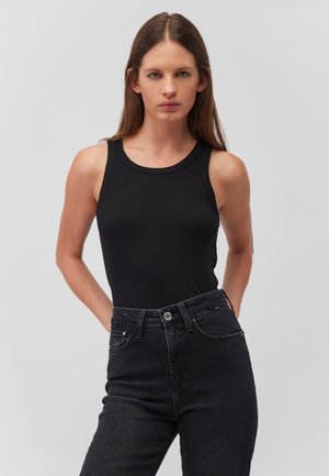 Black ribbed tank top with a round neckline, paired with high-waisted black denim jeans. Simple design with no visible patterns or accents.