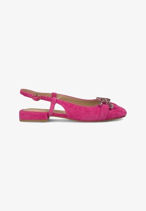 Pink suede slingback flats with a low block heel, featuring a decorative rhinestone accent on the toe and adjustable ankle strap.