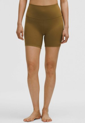 High-waisted, brown athletic shorts made of stretchy fabric. Features a smooth texture and short length, suitable for workouts.