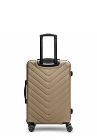 Hartschalentrolley mit Zickzackdesign, mattem beigen Finish, ausziehbarem schwarzen Griff und vier Doppelrollen für einfache Mobilität.