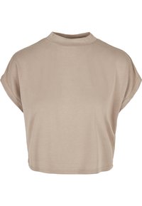 Tricou scurt de culoare bej deschis cu guler înalt și mâneci scurte. Fabricat dintr-un material moale cu o textură netedă și un design minimalist.