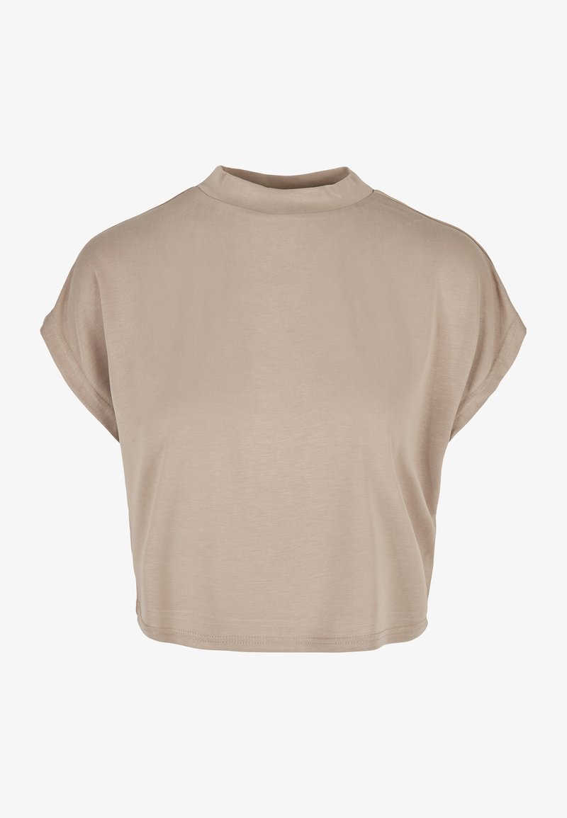 Gai bieži īsā krekla ar augstu apkakli un īsām piedurknēm. Izgatavots no mīksta auduma ar gludu tekstūru un minimālisma dizainu.