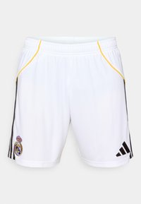 Shorts sportivi bianchi con strisce nere sui lati e accenti gialli, con un emblema ricamato sulla gamba sinistra e una vita elasticizzata.