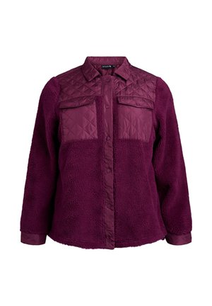 Giacca a camicia viola con una parte superiore trapuntata, due tasche sul petto, un tessuto inferiore morbido e chiusura a bottoni a pressione.