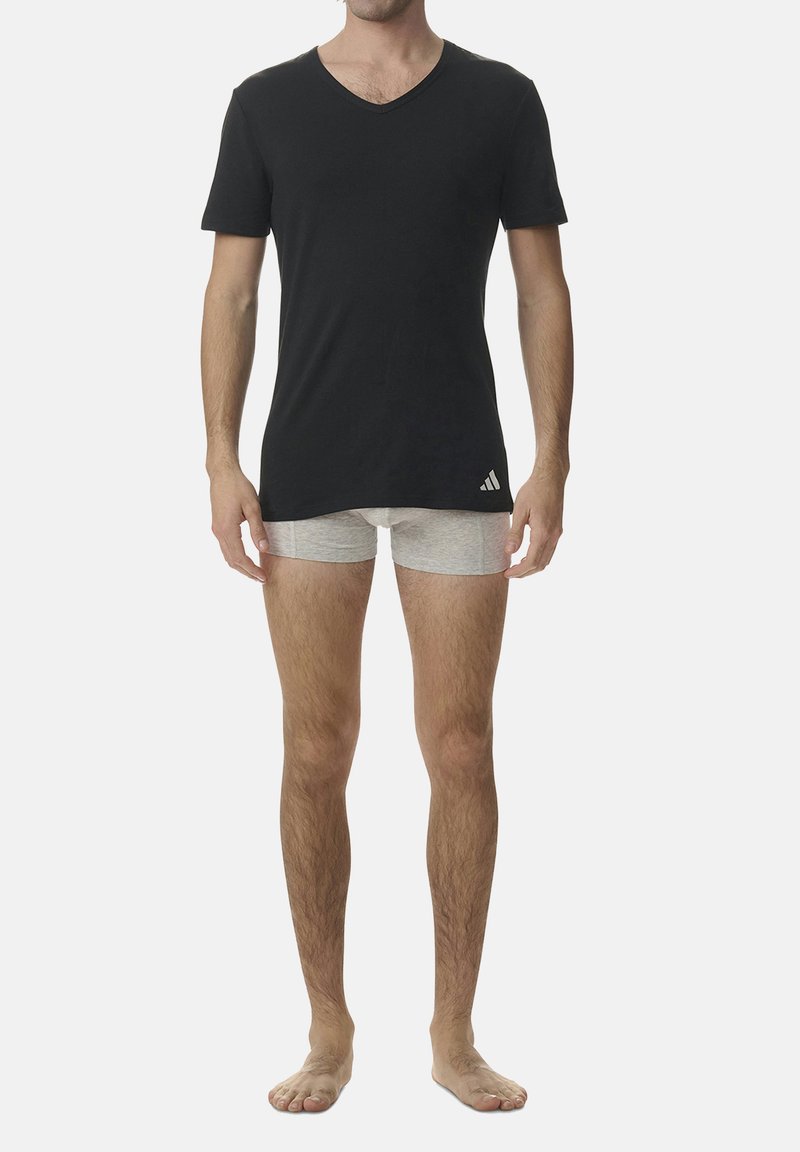 Black V-neck T-shirt with short sleeves, cotton blend material. Grey boxer shorts underneath, plain design, minimal branding.