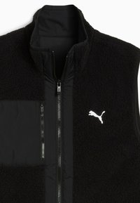 Schwarze Fleece-Weste mit Reißverschluss, hohem Kragen und einer Brusttasche auf der linken Seite. Verfügt über schwarze Nylon-Akzente und ein weißes Puma-Logo. Weicher Stoff.