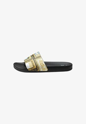Black slide sandal with a wide decorative strap featuring a gold and blue baroque pattern. Textured footbed for comfort. Flat sole design.