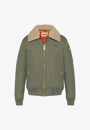Olijfgroene bomberjack met een crèmekleurige bontkraag, oranje voering, gouden rits en zijzakken. Het heeft een gestructureerde stof en geribde manchetten.