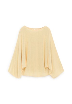 Haut beige à manches longues ample avec larges manches chauve-souris et col rond, présenté sur fond blanc.