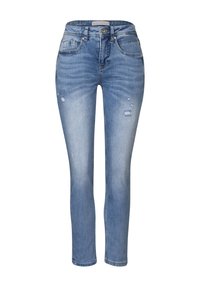 Modré džíny z denimu s volným střihem, s lehkým opotřebením, pěti kapsami a klasickým zapínáním na knoflík a zip.