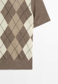 Short-sleeve knit sweater with a brown, beige, and cream argyle pattern on the front and solid brown sleeves.