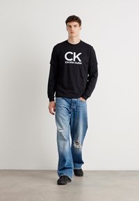 Calvin Klein Jeans GRAPHIC TEE - T-shirt print - black