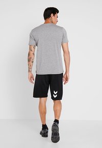 Hummel HMLGO BERMUDA - Sportiniai šortai - black