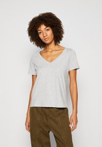 Gray short-sleeve V-neck t-shirt crafted from soft fabric, featuring a relaxed fit and smooth texture. Simple design, no patterns or accents.