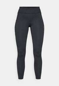 Schwarze Sportleggings mit hohem Bund, glatter Textur und seitlichen Taschen. Mit sichtbaren Nähten und einem Markenlogo am Bein.
