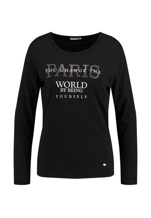 Schwarzes Langarm-T-Shirt aus weichem Baumwollmaterial, mit metallischen Buchstaben und dem Aufdruck "PARIS, DU VERÄNDERT DIE WELT, INDEN DU DU SELBST BIST".
