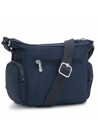 Navy blue nylon crossbody bag with a zippered main compartment, front zip pocket, and adjustable strap. Features textured accents.