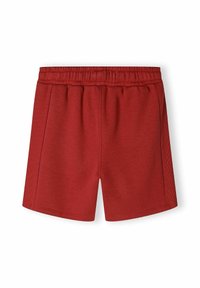 Shorts de sport rouges en tissu lisse et doux. Dotés d'une taille élastique et de détails de couture sur les côtés. Longueur courte, coupe décontractée.