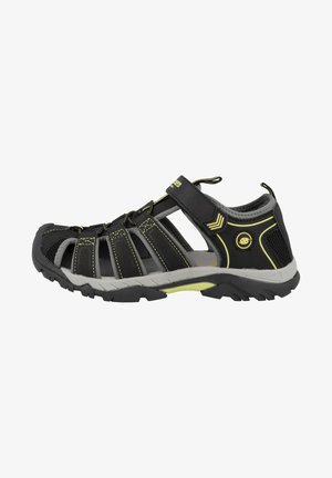 Black and gray outdoor sandal with adjustable strap, mesh panels, rubber sole, and yellow accents. Features a rugged tread for traction.