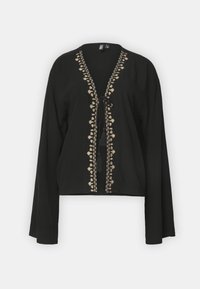 Blusa nera con maniche lunghe, scollatura a V e delicati ricami dorati lungo la parte anteriore e il collo, con chiusura legata.