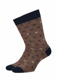 Brązowe skarpetki z teksturowanym wzorem małych czarnych, białych i granatowych krzyżyków. Granatowe ściągacze i wzmocniony obszar palców.