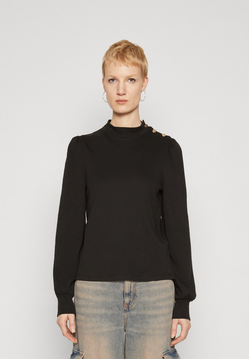 Black long-sleeve top with a high collar, featuring puffed shoulders and gold button accents on one shoulder. Soft, stretchy fabric.