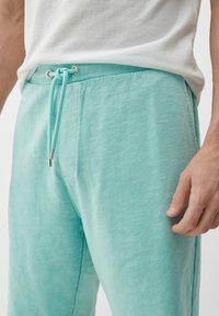 s.Oliver Pantaloni sportivi - helles türkis