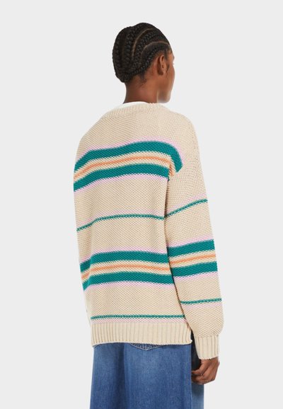 Knitted beige sweater with turquoise, orange, and pink stripes. Features a rounded neckline and ribbed cuffs. Worn with blue jeans.