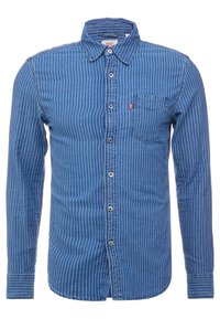 Blauw gestreepte button-up shirt gemaakt van dennenstof. Heeft een kraag, een voorzak en lange mouwen met knopenmanchetten.