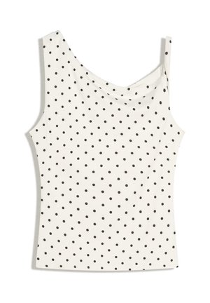 Top bianco senza maniche con pois neri, con una spallina larga e una sottile sulle spalle opposte.