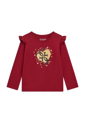 T-shirt rouge à manches longues pour tout-petit avec épaules à volants, motif cœur et étoile dorés, et logo noir stylisé au centre.