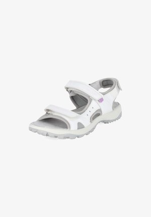 Sandale de sport blanche avec brides Velcro ajustables, bout ouvert, semelle matelassée et semelle robuste, présentée sur un fond blanc uni.