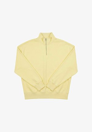 Sudadera de manga larga en amarillo claro con puños y bajo acanalados, con cuello con cremallera hasta la mitad y cuello alto.