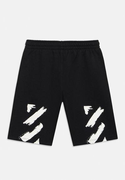 Μαύρα σορτς με ελαστική μέση και λευκά αφηρημένα σχέδια πινέλου και στα δύο πόδια, σε απλό φόντο.