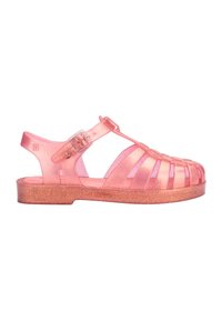Translucent pink jelly sandal with a strap and buckle closure, featuring cut-out design, glitter detailing along the sole, and textured finish.