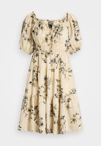 Beiges knielanges Kleid mit Puffärmeln, elastischem Bund, schichtweise Rock und blauem sowie senfgelbem Blumenmuster.