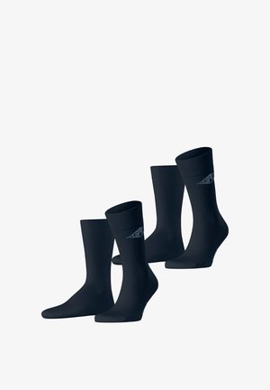 Schwarze Socken im Rippendesign mit Logo-Akzent und glatter Textur. Vier Paar in einer Verpackung enthalten. Mittellange Knöchel.