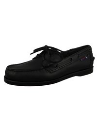 Bateau en cuir noir avec une pointe arrondie, des coutures décoratives et des lacets traversant des œillets en métal. Texture lisse avec une semelle en caoutchouc antidérapante.